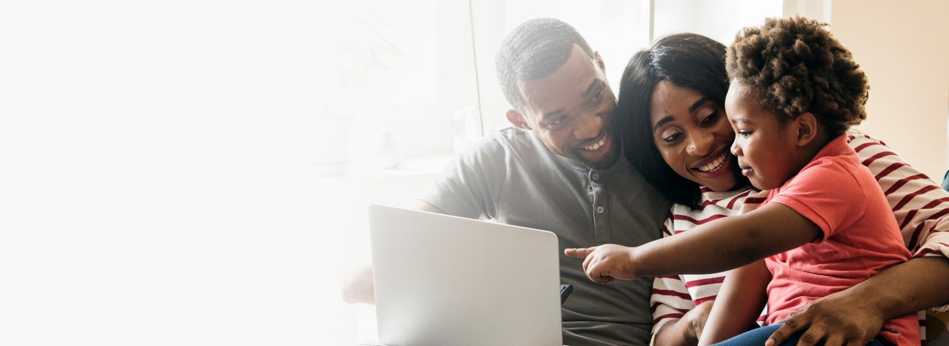 happy-black-family-toddler-pointing-laptop-screen-design-space_53876-97128 happy-black-family-toddler-pointing-laptop-screen-design-space_53876-97128